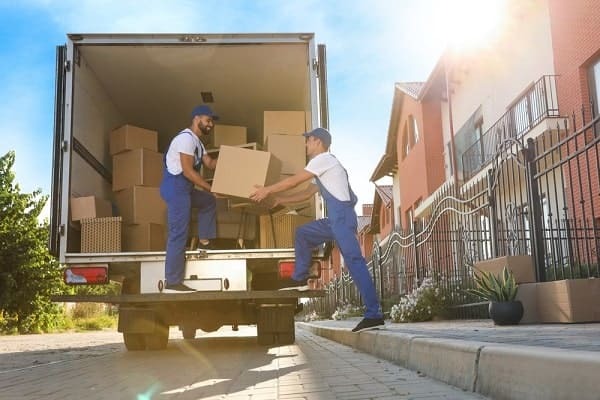 Movers loading boxes into a truck